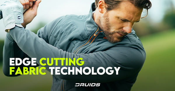 A golfer mid-swing wearing a sleek, grey golf jacket with the text "EDGE CUTTING FABRIC TECHNOLOGY" highlighted.
