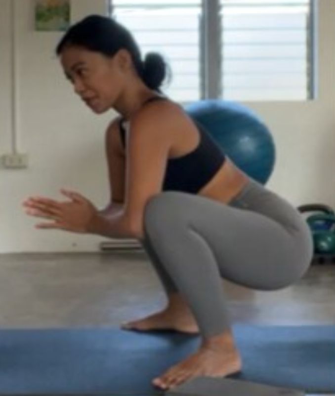 wide legged squat variation 1 - Yoga for Lower Back