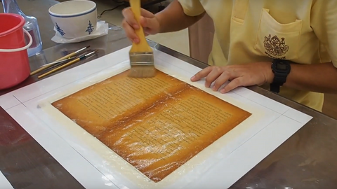 Applying methycellulose adhesive on top of both paper