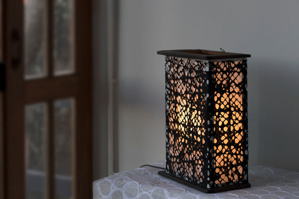Heavily-textured Handmade Fishnet Kozo Paper lends its unique appearance to the lamp