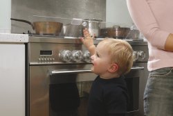 Child touching the cooker