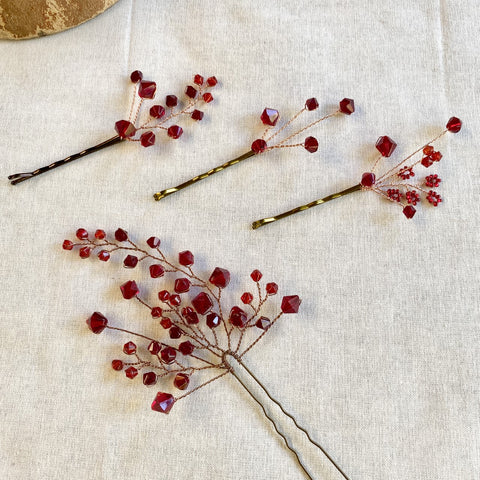 3 bobby pins with red beads, plus a larger hair comb with many red beads attached