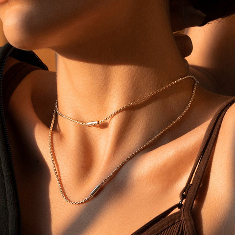 Woman wearing FOPE layered necklace