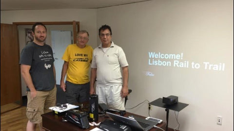 Wayne and Travis Wallace with Rakesh Dhawan, President of Falco eMotors