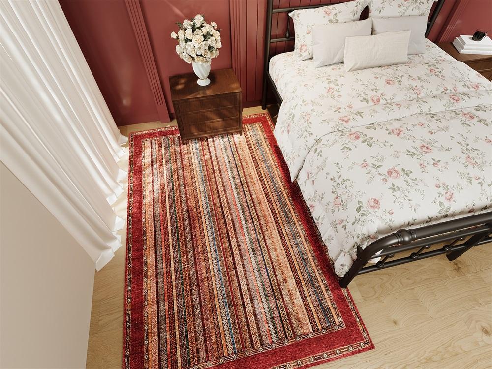 Rugitall Stripy World Red & Burgundy Rug beside a floral white bed