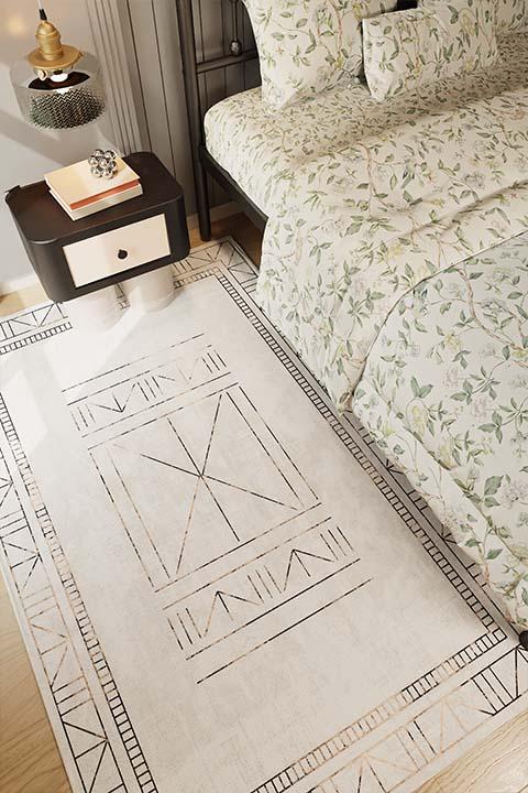 Solemnity Besieged Gray Hallway Rug beside floral-themed bedding