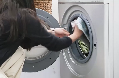 Toss the upper rug cover in the washer