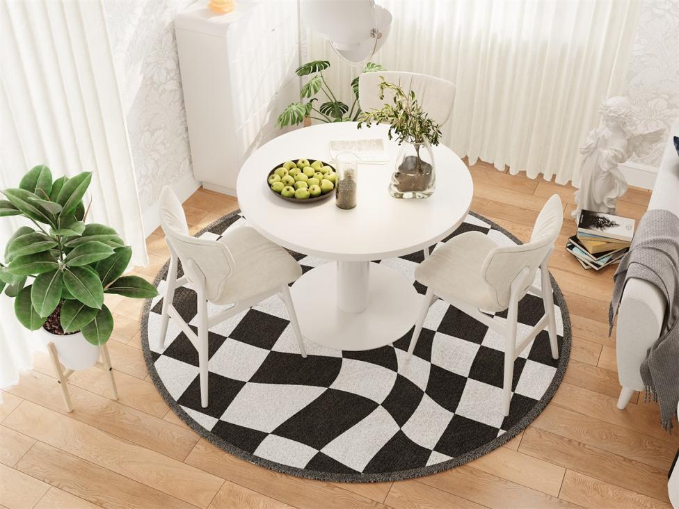 Round Rugitall Trap Checkerboard Black & White Rug under a chat table