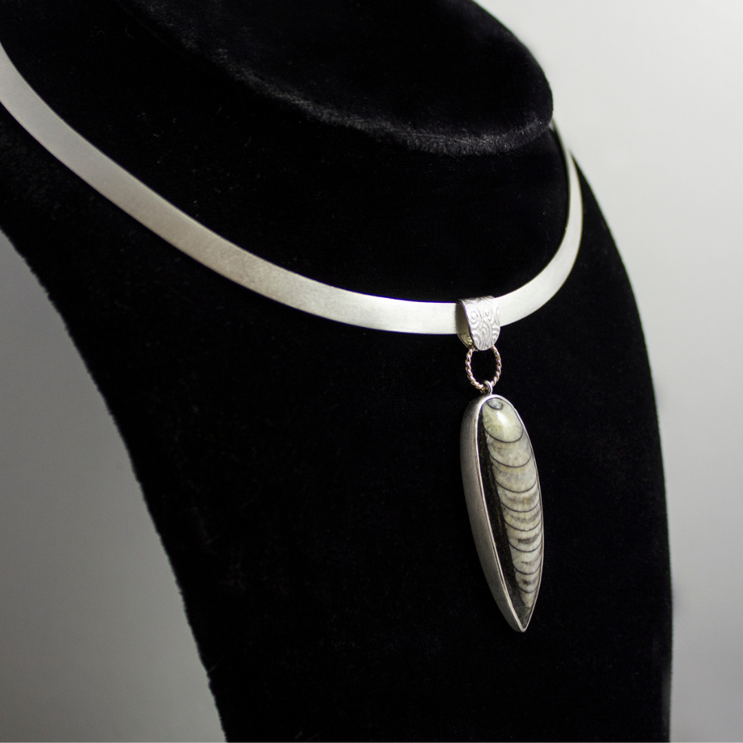 fossil pendant on hand-forged collar