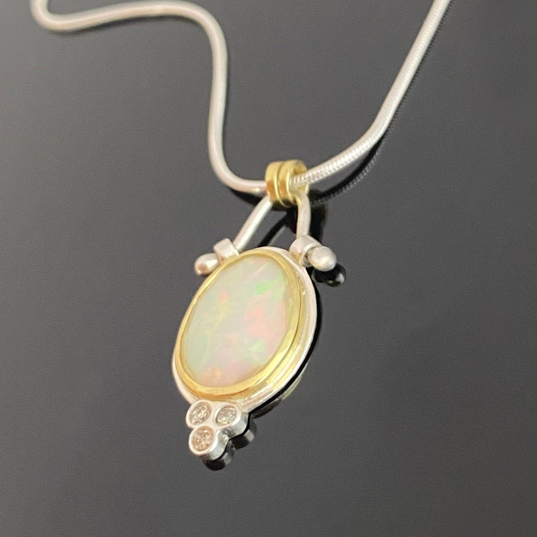 opal and diamond pendant in silver and 14ct gold