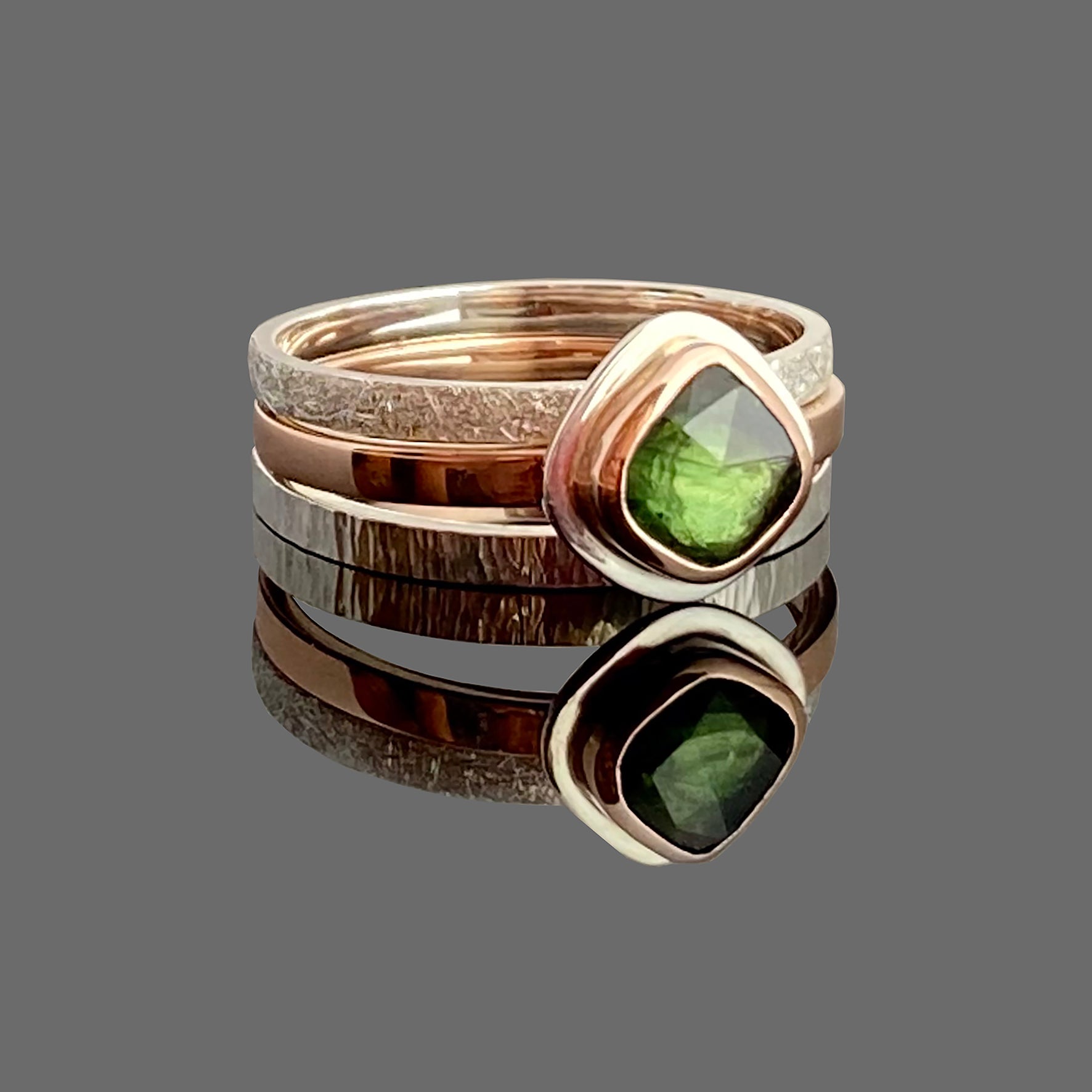 green Sapphire stacking rings in red gold and silver