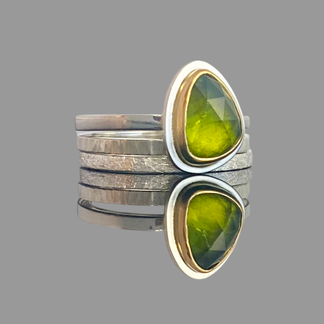 peridot stacking rings in gold and silver