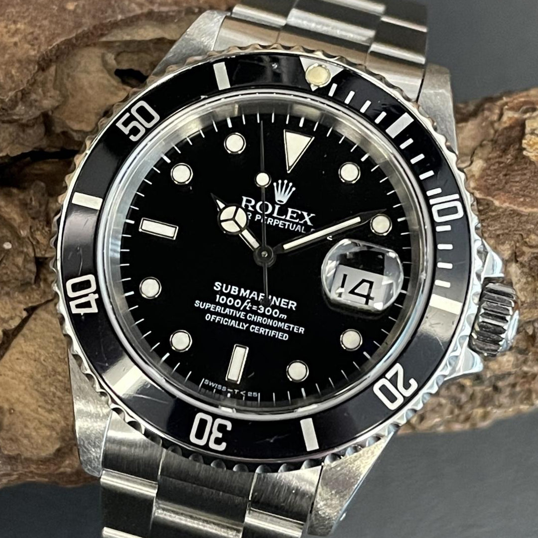 Rolex 16610 atop of stone