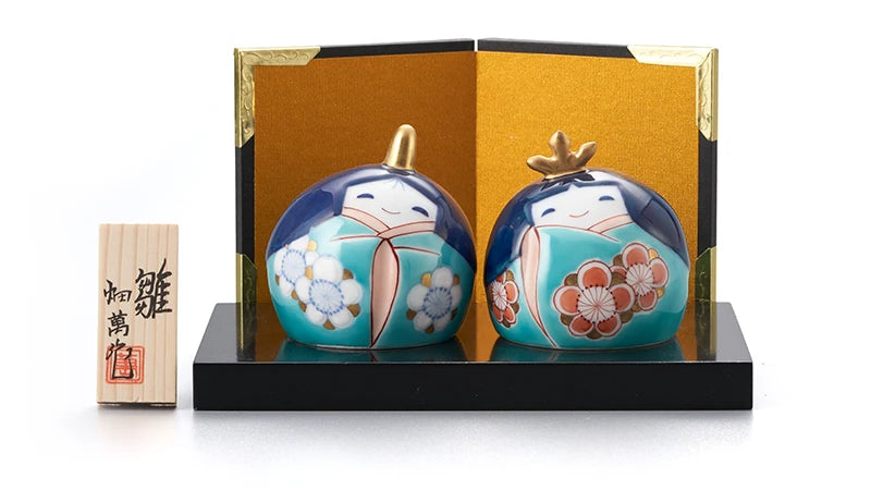 Kokeshi dolls with plum blossoms