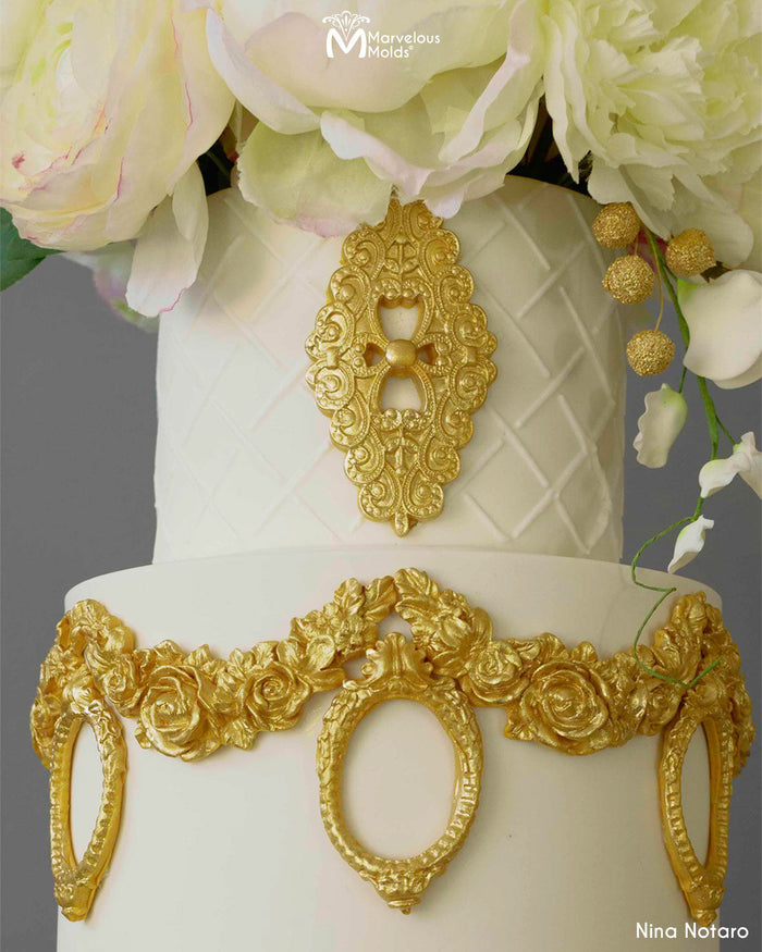 https://cdn.shopify.com/s/files/1/0652/6704/0476/products/White-gold-wedding-cake-closeup-detail-enchanting-brooch-marvelous-molds.jpg?v=1675892246&width=700