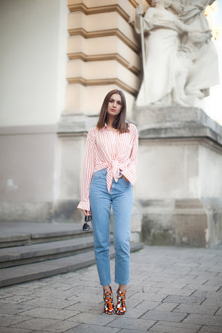 Woman wears jeans and statement shoe