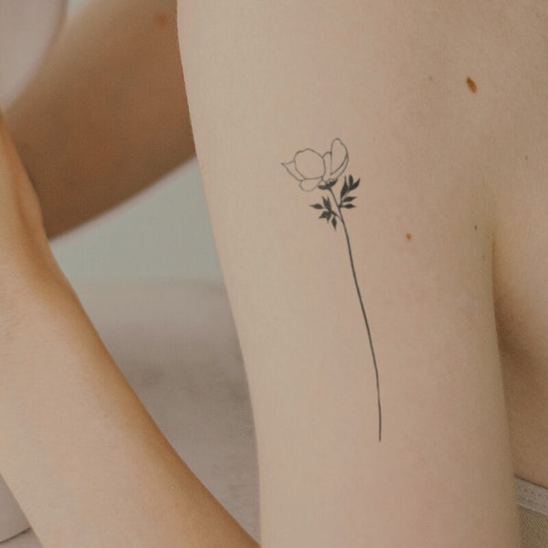 fine line single flower tattoo back of armTikTok Search