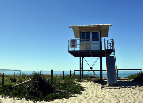 "Lifeguard OFF Duty" - Surf Life Saving Lookout Tower at Blacksmiths beach. Camping is not allowed at the beach.