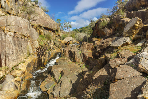 Get dirty on your 4WD trip and take a shower in a waterfall in Paruna Wildlife Sanctuary, Avon Valley, Perth.