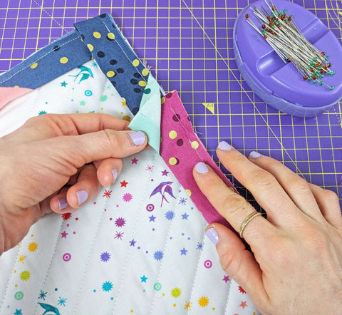 Use bias binding to finish a quilt edge