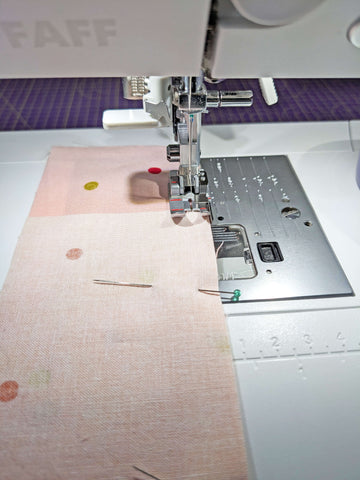 Sewing strips together for handmade quilted placemat