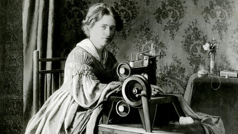 Woman using Singer sewing machine