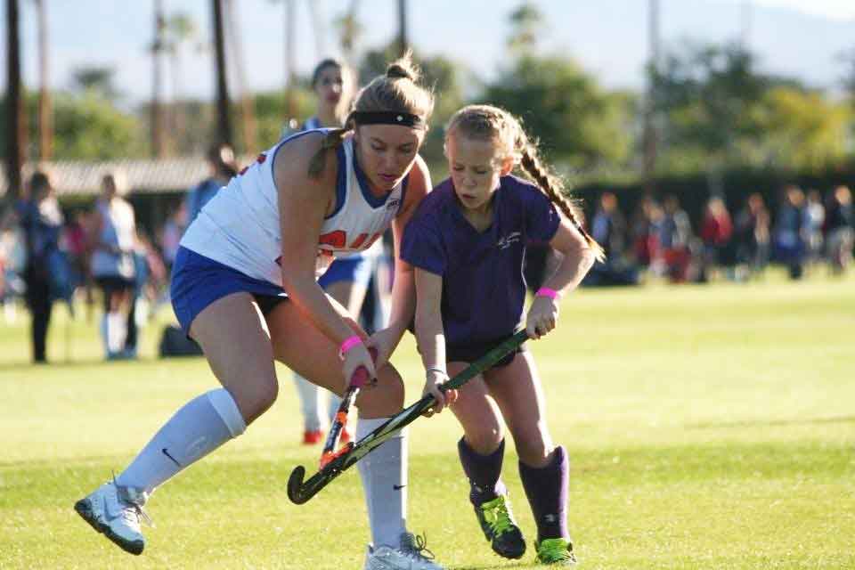 Sophia and another field hockey player on the pitch.