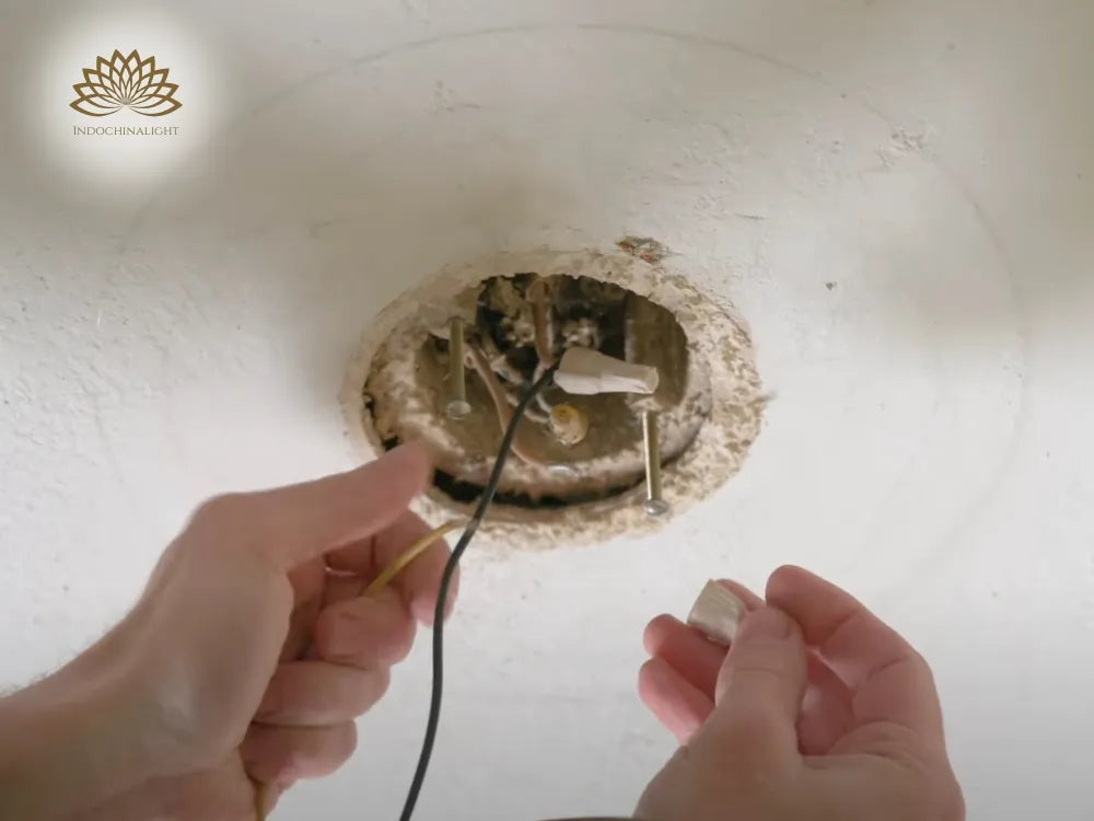 Undo the wire nut by turning the counterclockwise