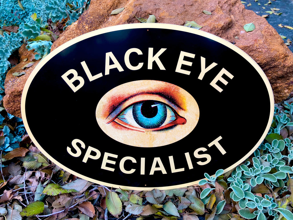 Black Eye Specialist Metal Sign - Yellow Beak Press