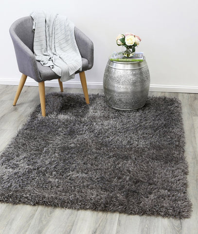 Charcoal shaggy rug under chair- Rugs Direct