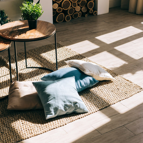 Jute summer rug with pillow on top