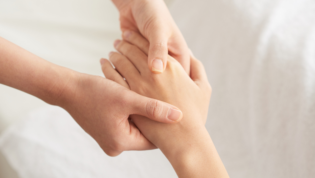 Hand rejuvenation transforming skin, two hands holding one hand on white background