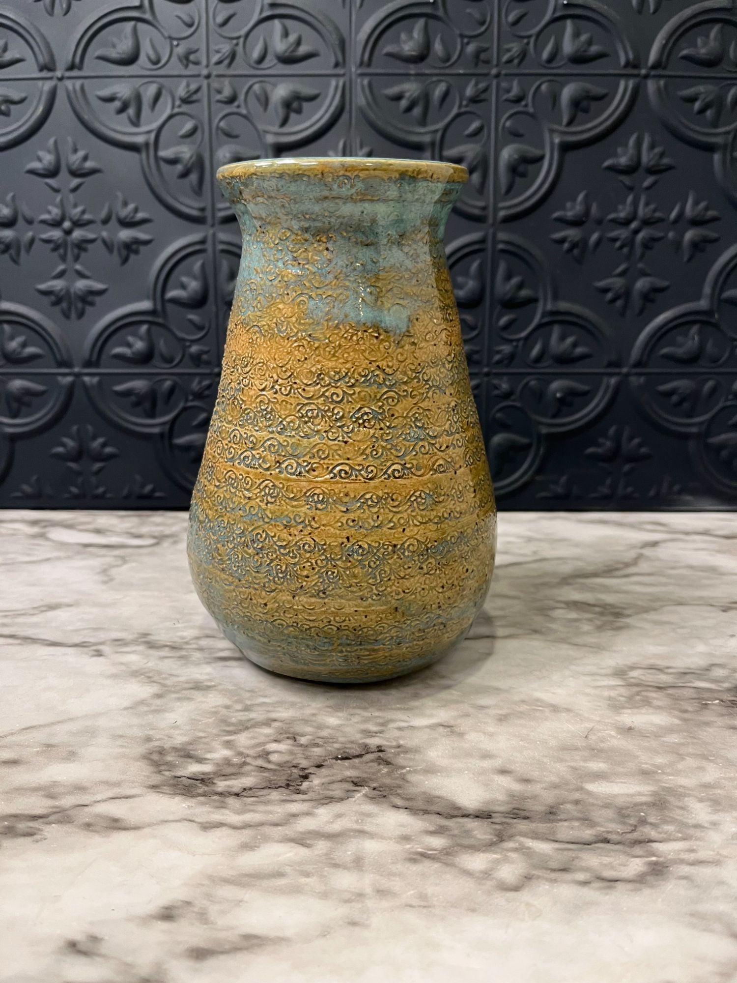 Blue and Tan Pottery Vase With Textured Finish