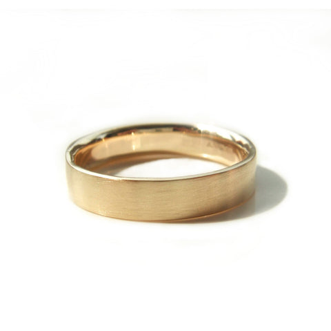 Yellow gold flat court modern wedding band with brushed texture and comfort fit