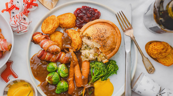 Gluten Free Turkey Pie on a plate with all the Christmas trimmings. Made by Baked to Taste.