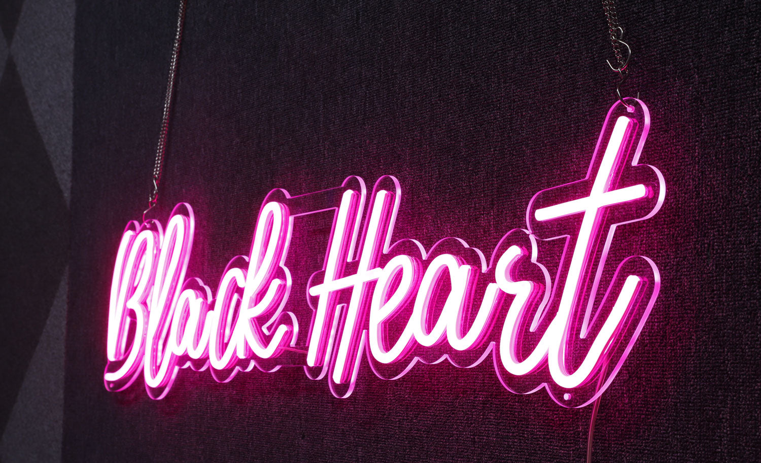 black heart text neon sign in fuchsia