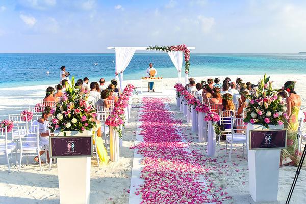 Pink flowers on white carpet aisle runner