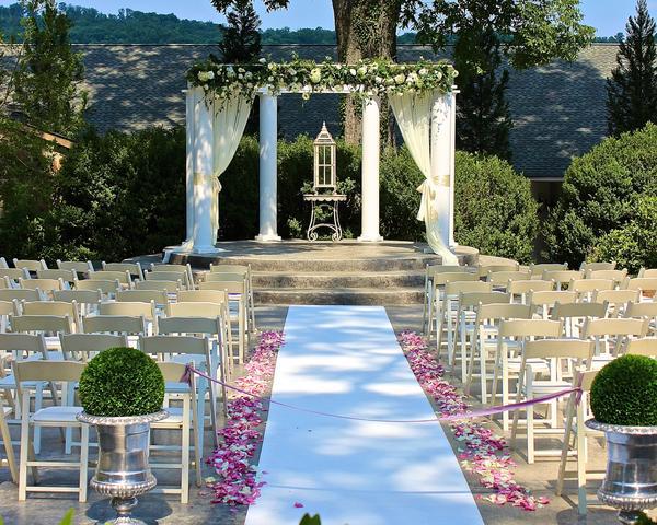 White carpet aisle runner for wedding ceremony