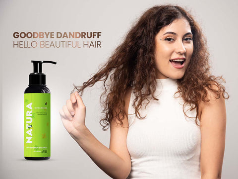 Happy woman showcasing her curly hair with Anti-Dandruff Shampoo, symbolizing a dandruff-free, healthy hair routine