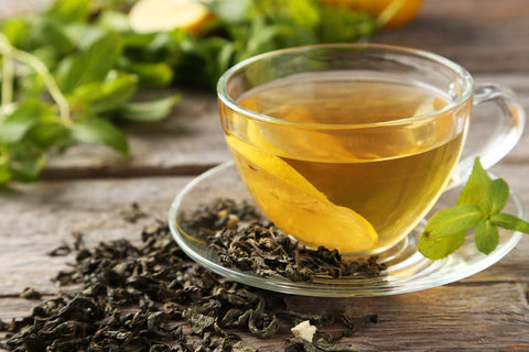 Spearmint tea in a cup on a table, symbolizing its use in treating Hirsutism