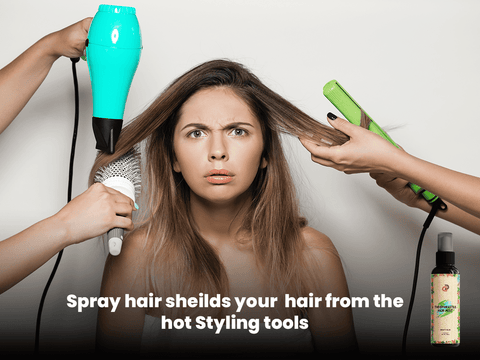 Woman using hair spray as a protective shield during hair styling with heat tools