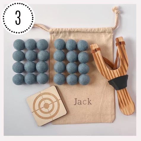 wooden slingshot with felt balls, personalized bag and targets