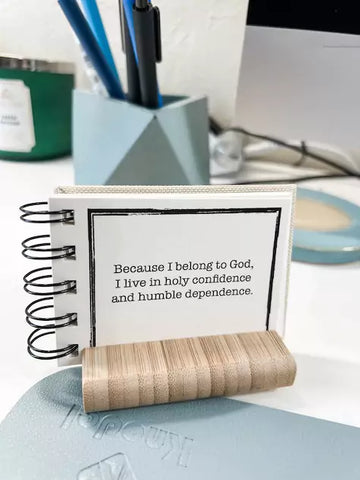 christian affirmation book open and displayed on desk.