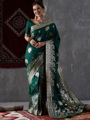 Heave work green saree with solid blouse