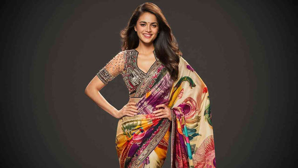 A photorealistic image of a South Asian woman confidently posing in a stunning Paithani saree paired with a trendy, embellished blouse. The saree features vibrant colors and intricate designs, while the blouse complements it with a modern touch. The woman's smile exudes confidence and joy.