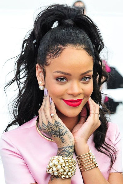 Rihanna- Messy half-up, half-down hairstyle