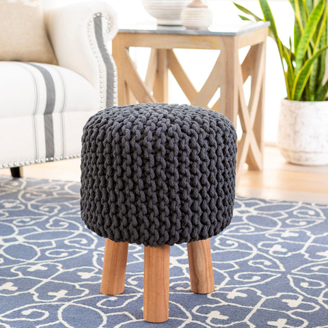 A boucle stool in a bohemian-themed room