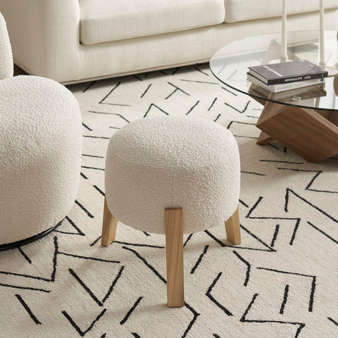 A boucle stool in a minimalist setting