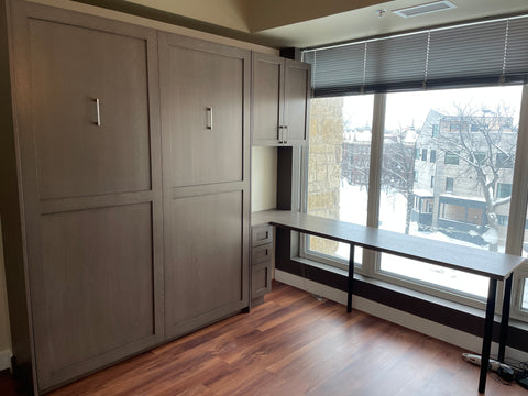 shaker style murphy bed with desk and storage cabinets in a condo