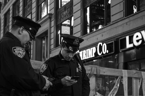 Police officers checking phones